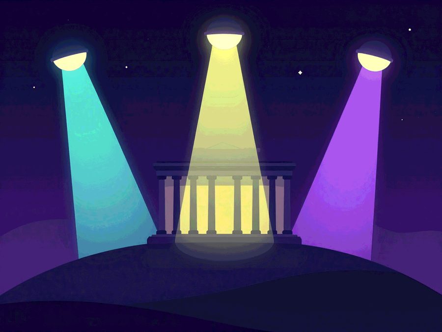 Um prédio público iluminado por três holofotes de cores diferentes, que colorem partes distintas da fachada